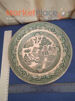 Old willow patent plate with an old maker pottery.