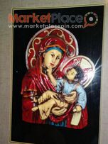 Παλαιά χειροποίητη εικόνα της Παναγίας σέ ξύλινη κορνίζα.